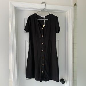 Black Manydress size M dress with buttons and pockets.